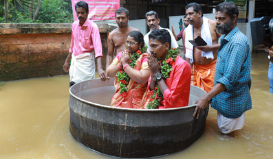 Akash Kunjumon and Aishwarya heading to the wedding venue in a cooking vessel